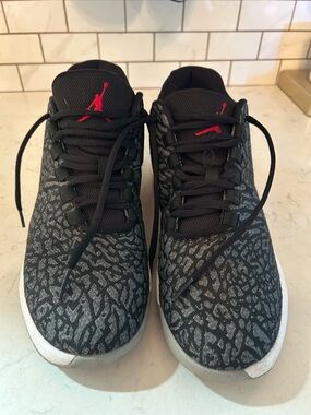 These are a pair of Nike Jordan B. Fly "Elephant Print" sneakers.  Size 8 Men’s